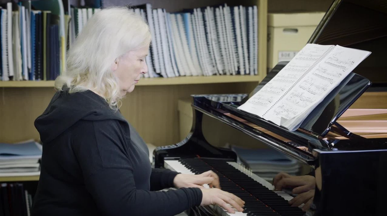 Julia Richter sat at piano with sheet music